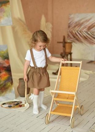Іграшкова коляска для ляльок жовтий горошок1 фото