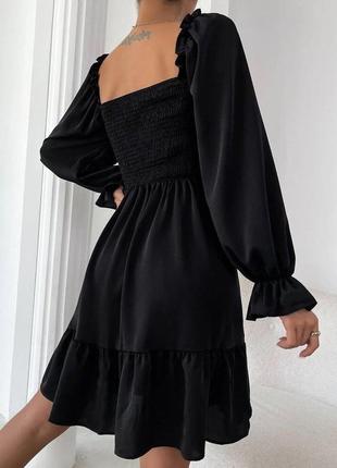 Легкое платье с воланом по низу и настроченой резинкой по груди черный4 фото