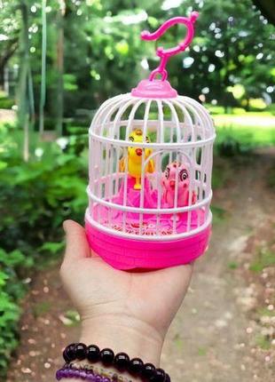 Іграшка на батарейках "пташки в клітці" (рожевий), вид 22 фото