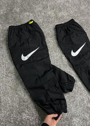 Nike nylon pants side swoosh штаны nike нейлон штаны nike штаны swoosh штаны nike big swoosh штаны спортивные4 фото