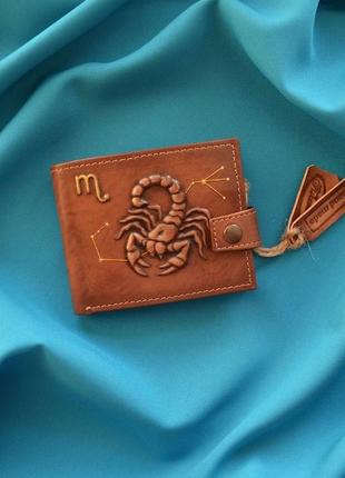 Коричневий шкіряний гаманець "скорпіон"1 фото