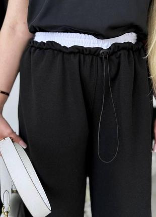 Женские весенние брюки свободного кроя с кулисой на резинке размеры 42-604 фото