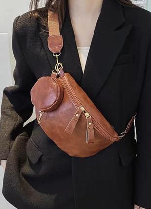 Маленька шкіряна жіноча сумка 2024, новий літній стиль, модна версія, сумка на пояс.5 фото