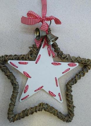Декоративна підвіска зірка з дзвіночками.1 фото