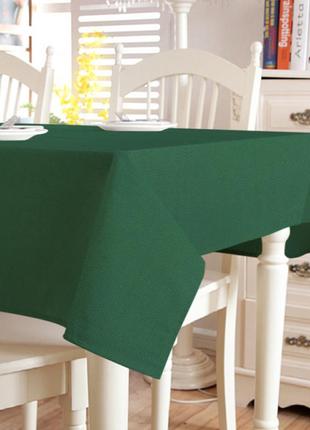Красива ошатна темно-зелена скатертину на стіл