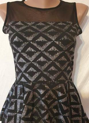 Чорна блуза з блискітками з прозорою спинкою