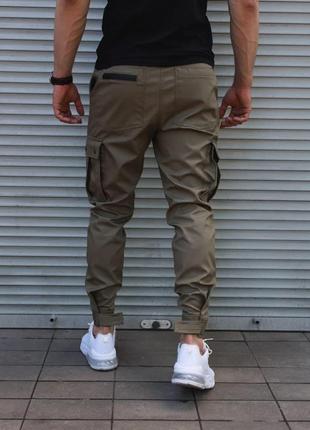 Мужские стильные брюки-джоггеры на манжетах с клапанами хаки3 фото