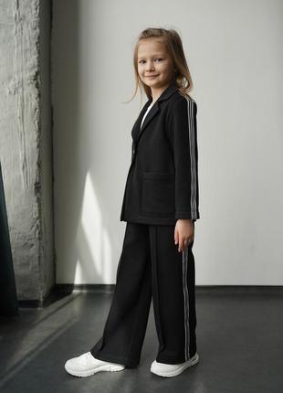 Дитячий підлітковий брючний костюм с лампасами в чорному кольорі для дівчинки 1463 фото