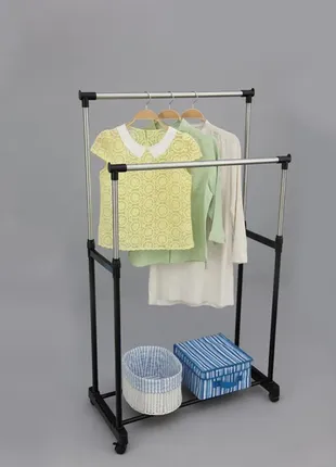 Подвійна пересувна стійка для одягу