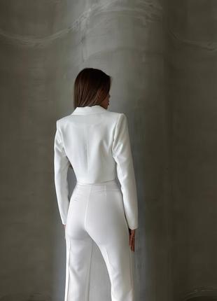 Брючный костюм пиджак и брюки клеш2 фото
