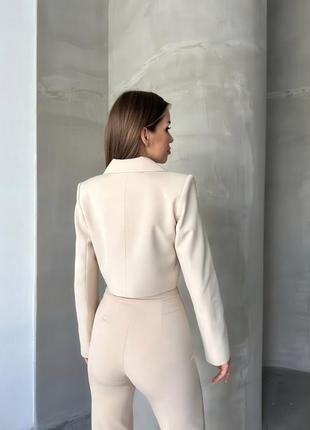 Брючный костюм пиджак и брюки клеш3 фото