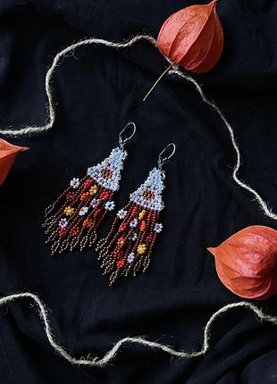 Сережки з бісеру з сонцем і кольоровими квітами