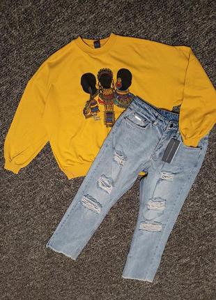 Новые рваные джинсы