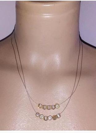 Кольє-невідимка, камінці на невидимій нитці