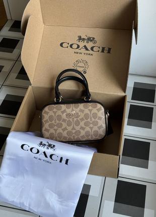 Сумка coach satchel crossbody in signature beige/black