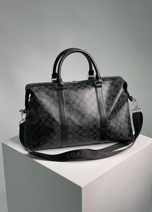 Черная сумка из натуральной кожи coach