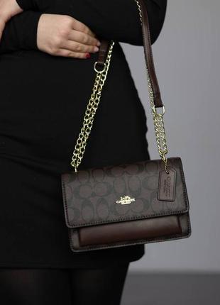 Коричнева жіноча сумка коач coach mana klare