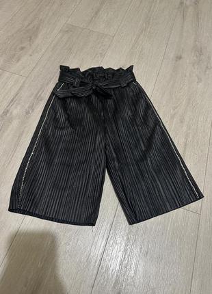 Шкіряні штани 104см з камінчиками відблискуючими