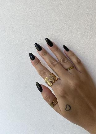 Кільце золотисте неіржавка сталь із буквою