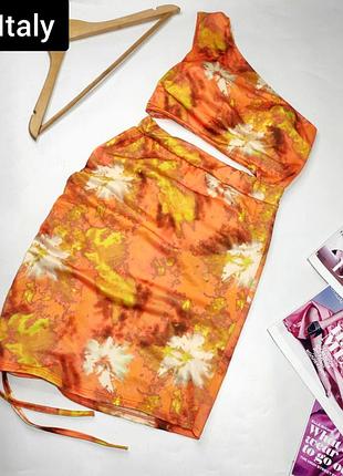 Платье женское мини оранжевого цвета в принт на одно плечо с завязками от бренда italy xs s