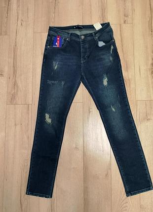 Темно-сині джинси