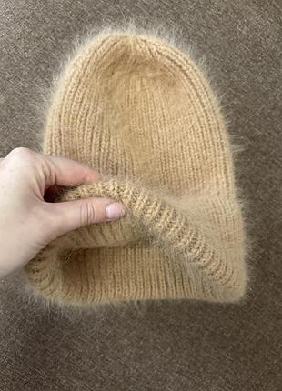 Брендова теплюща шапка