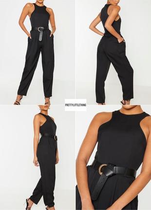 Черный брючный комбинезон с карманами prettylittlething
