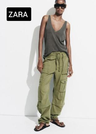 Брюки карго жіночі хакі з середньою посадкою з вілстьогуваючими штанинами від бренду zara 32