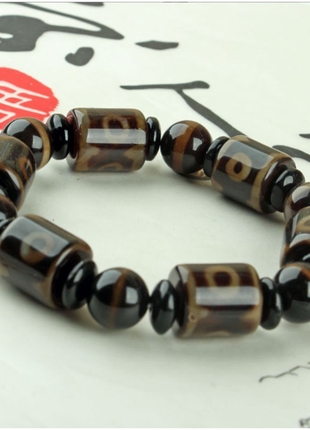 Браслет шість коричневих триоких дзі