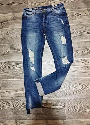 Джинсы рваные