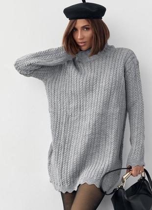 Удлиненный oversize свитер в косы