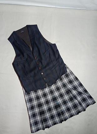 Жилетка вовняна іссиня-чорного і коричневого кольору,принт ледь помітна клітинка