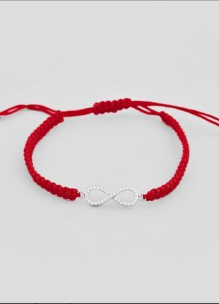 Красная нить со знаком бесконечности