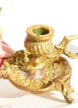 Старинный подсвечник-ночник с ручкой для удобного переноса.