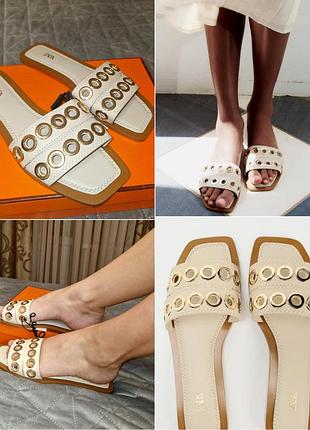 Кожаные шлепанцы zara на низком ходу с металлическими аппликациями.