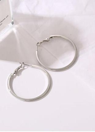 Круглые серебристые серьги