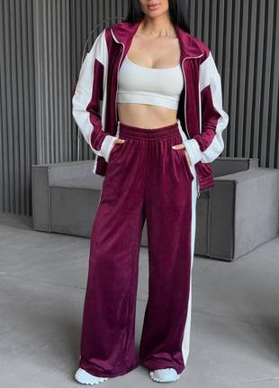 Велюровый комбинированный спортивный костюм с кофтой на молнии с манжетами со свободными брюками с карманами5 фото