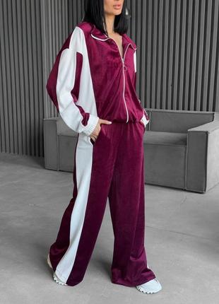 Велюровый комбинированный спортивный костюм с кофтой на молнии с манжетами со свободными брюками с карманами7 фото