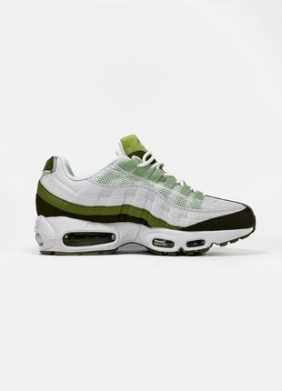 green nike shoes with camo trim and blue color