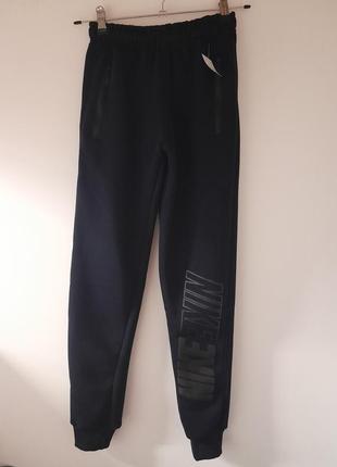 Штани спортивні підліткові сині на флісі nike т-8368 . розміри:40,44,46