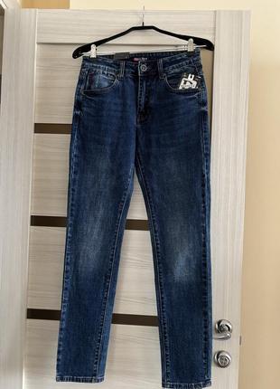 Новые синие джинсы
