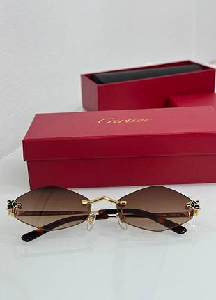 Женские коричневые солнцезащитные очки cartier eyewear tiger  ct0433s-002 55 золотая оправа