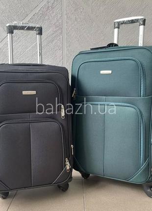 Чемодан из ткани на 4-х колесах бренда wings poland