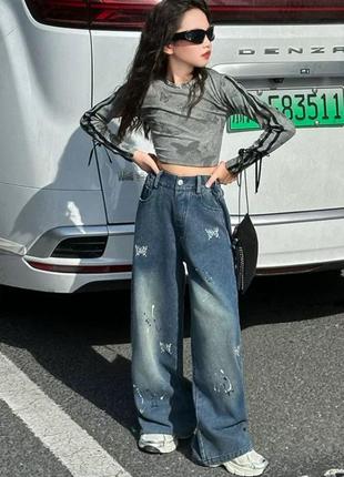 Стильні підліткові джинси оздоблені метеликами з блискіток