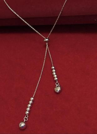 Срібне позолочене кольє краватка з кульками та серцем.