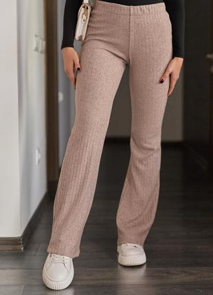 Бежеві молочні трикотажні штани в рубчик