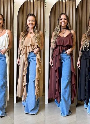 В наявності асиметрична блуза з воланами