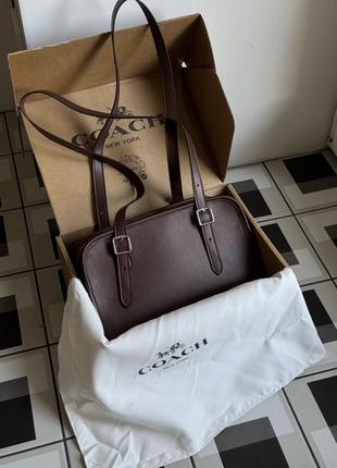 Натуральная кожаная темно-коричневая женская сумка бренд coach 1941 swing zip bag chocolate