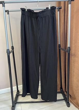 Жіночі брюки кльош від стегон