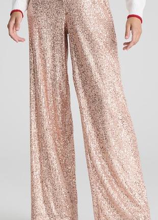 Элегантные брюки в пайетках золотистые